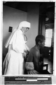 Maryknoll Sister Mercy, MD, listening for tuberculous, Shingishu, Korea, 1938