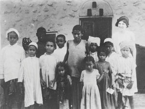 Missionary Anna Rinder Madsen, married to Richard Madsen, with her Sunday School girls in Aden