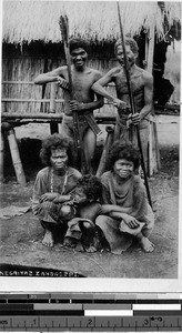 Five people in front of a house, Philippines, ca. 1920-1940