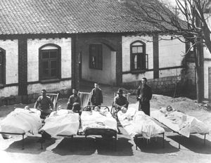 Manchuria/Dongbei, China. Patients in front of the hospital, Antung/Dandong