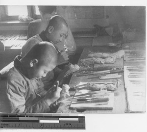 Boys learning the art of woodcarving at Fushun, China, 1936