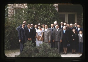 Group outside red brick building