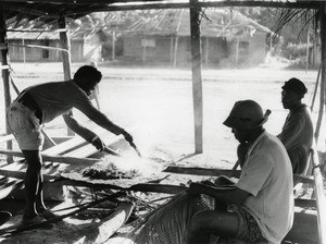 Man making a basket, in Gabon