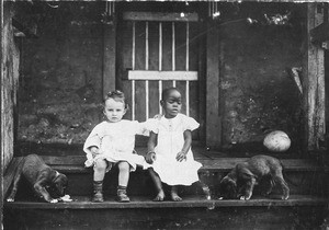 Girls with puppies, Shira, Tanzania, ca.1900-1912