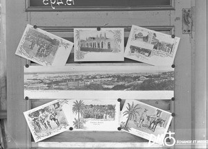 Postcards on a door, Maputo, Mozambique, 1907