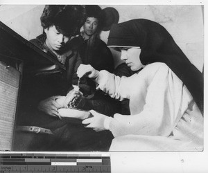 Sister M. Paula at dispensary at Fushun, China, 1940