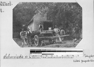 Men with ox cart at a forge, Elim, South Africa