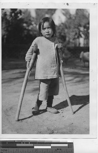 A child on cruches in China, 1941