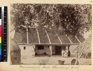 Indigenous preacher outside his house with children, Bhimasingi, India, ca.1885-1889