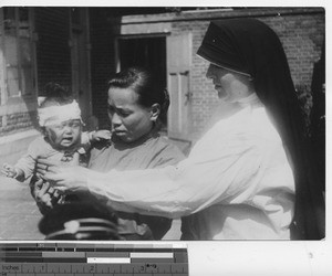 Maryknoll sister at dispensary at Fushun, China, 1937