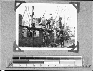 Men building a house in Lusubilo, Nyasa, Tanzania, 1936