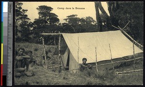 Men sitting outside a tent, Papua New Guinea, ca.1900-1930