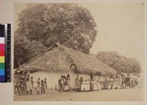 Female missionary worker with students outside school, Kerala, India, ca.1880-1890