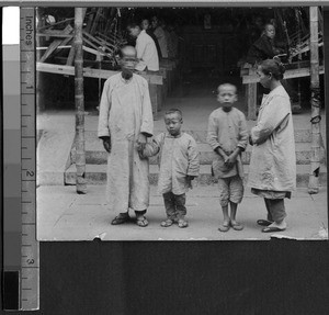 Women and children with workers at looms, Fujian, China, ca.1915