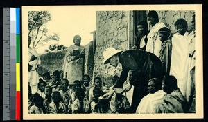 Missionary father feeds leprosy patients, Madagascar, ca.1920-1940