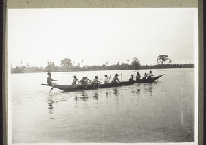 Schoolboys in a canoe