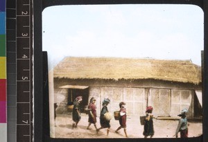 Women arriving at a town in the Shan Hills, Myanmar, ca. 1930s