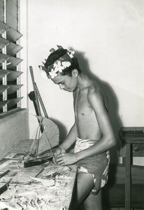 Special school of Moria. A boy makes a model of outrigger canoe