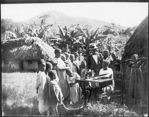 Woman with sewing-machine, Gonja, Tanzania, ca. 1927-1938