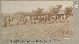 Machame warriors, moving to Arusha, Tanzania, 1900