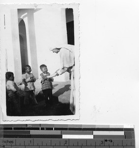 Children selling vegetables to Maryknoll Sisters at Tsungkow, China, 1939