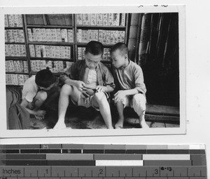 Boys reading in a library at Stanley, Hong Kong, China, 1939