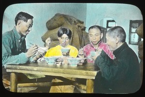 Four people sharing a meal around a table, China, ca.1917-1923