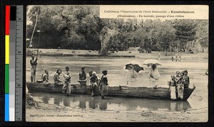 Missionary sisters standing in a narrow boat on a river, India, ca.1915