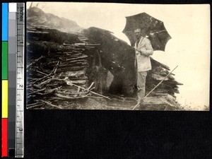 Checking out a mountain hut, Sichuan, China, ca.1900-1920