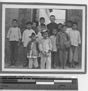 Fr. Paulhus with school boys at Yangjiang, China, 1924