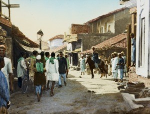 Walking in the street, India, ca. 1930