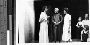 Maryknoll Sister Regina Marie Martin talking to two women, Wuchow, China, 1949