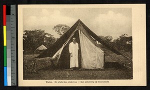 Catholic missionary father standing near tent, Congo, ca.1920-1940