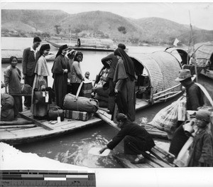 Maryknoll Sisters boarding a boat at Meixien, China, 1949