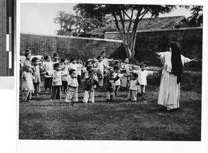 Maryknoll Sister teaches exercise to orphans, Loting, China, ca. 1935