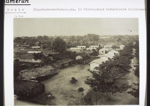 Cameroon, Duala: Native dwellings, with the catholic mission station in the background