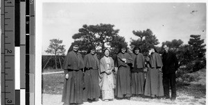 Five Maryknoll Sisters standing with Fr. Boesflug, MM, and Japanese woman, Karasaki, Japan, April 8, 1938