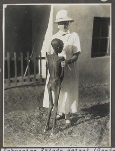 Nurse Frieda Wetzel with sick child, Tanzania, ca.1933-1935