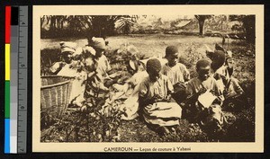 Children sewing outdoors, Cameroon, ca.1920-1940