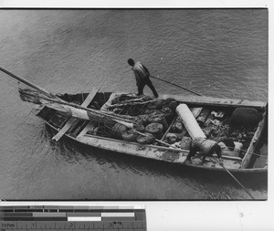 A junk boat in shallow water at Fushun, China, 1938