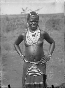 African girl posing in the savannah, Tanzania, ca.1893-1920