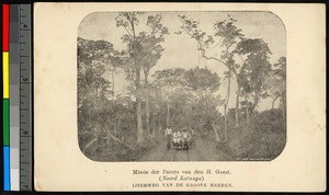 Men sitting on a rail cart amid a forest, Congo, ca.1920-1940