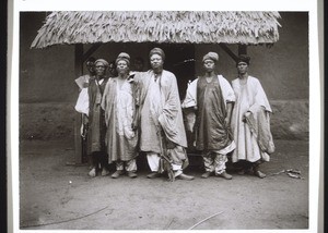 King Ndsoya and attendants in front of the entrance to his palace in Fumban