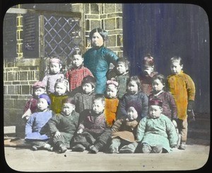 Teacher standing with a group of young students, Hunan, China, ca.1917-1923