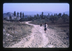 woman and girl, mountains in the background