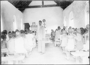 The teachers Abraham and Petro with a class at the mission school, Gonja, Tanzania, ca. 1911-1914