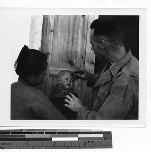 Fr. Herbert Elliott with Chinese mother and child at Guilin, China, 1950