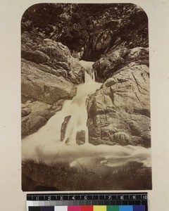 View of waterfall in forest, Madagascar, ca. 1865-1885