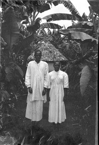 African couple between banana plants, Tanzania, ca.1893-1920