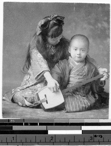 Children playing a shamisen, Osaka, Japan, ca. 1900-1920